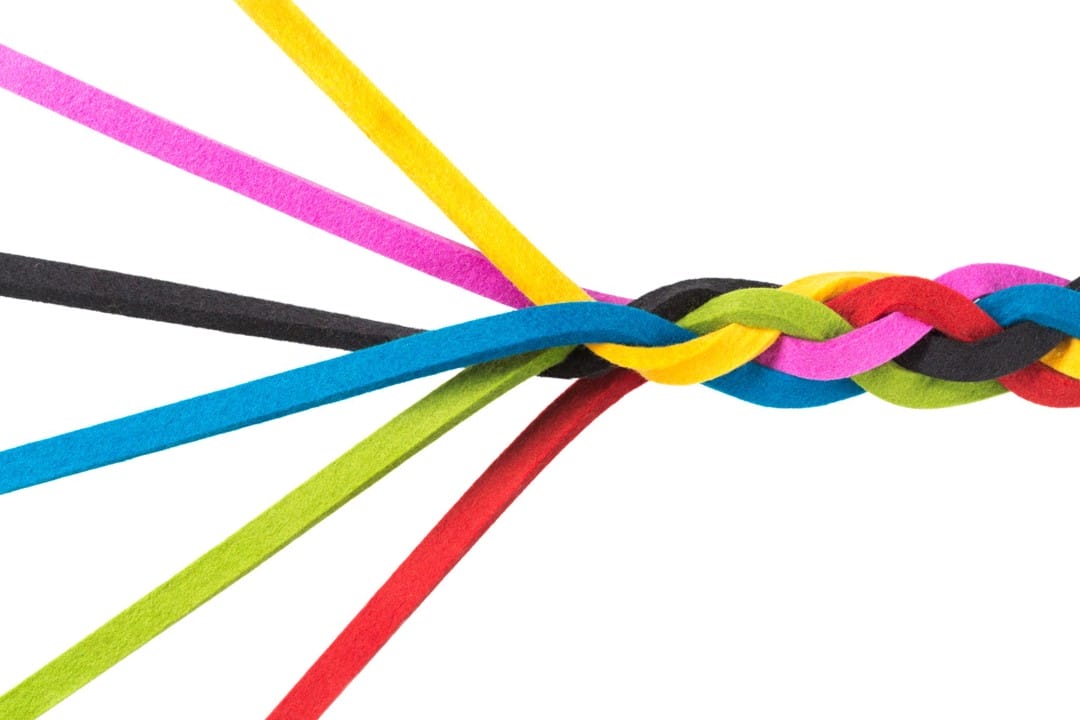 A colorful braided loom band made of elastic strands.