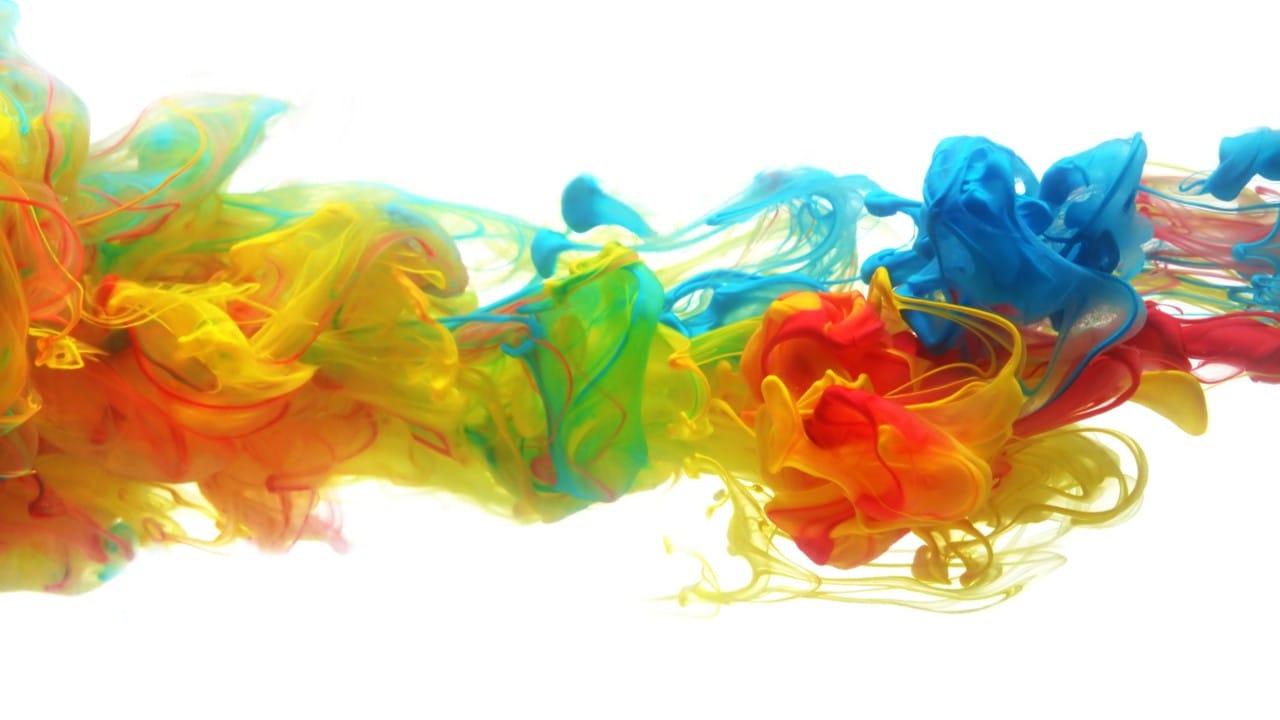 Bright, colorful liquids swirling together.