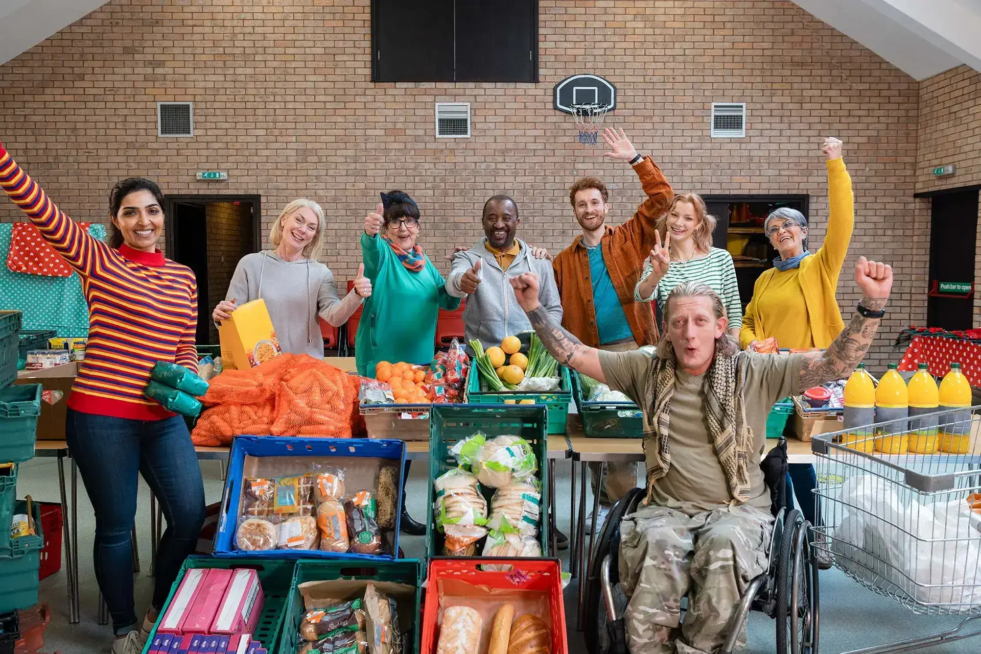 Team photo during food bank initiative, reflecting grassroots collaboration and community-led responses to disadvantage.