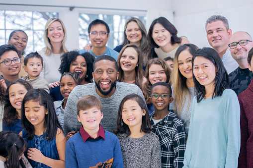 Group of people of different ages, symbolizing diversity, intergenerational engagement, and community connection.