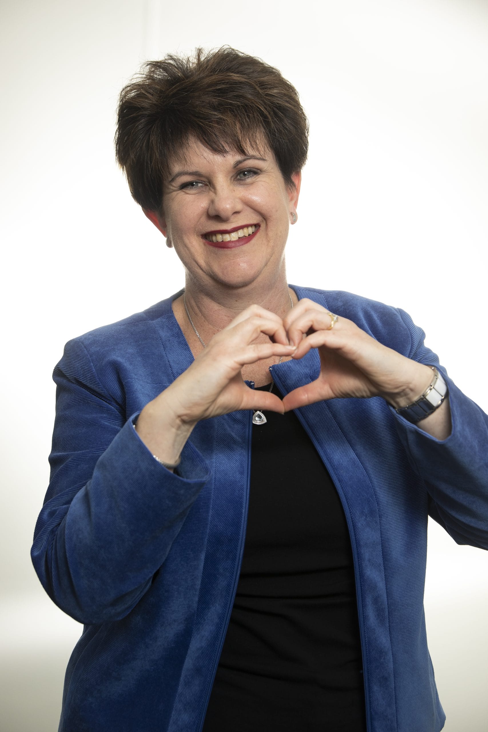 Tracey smiling, representing passion for healthcare, leadership, and community engagement in user-centered design.