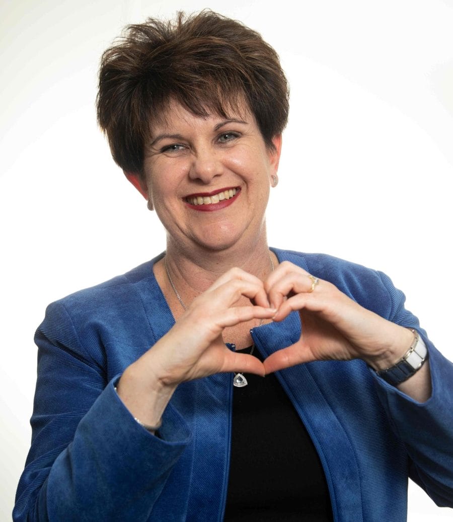 Tracey smiling, representing passion for healthcare, leadership, and community engagement in user-centered design.